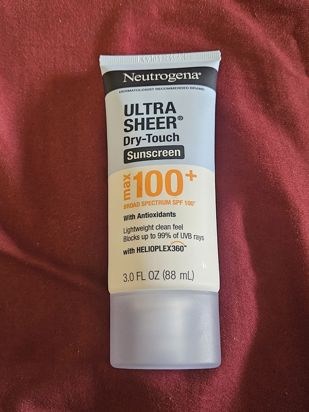 Neutrogena White and Orange Ultra Sheer Dry-Touch Sunscreen Tube